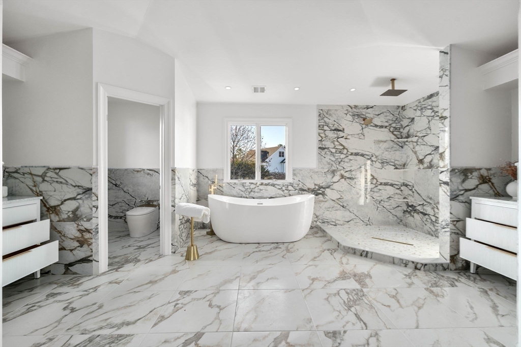 51 Pilgrim Road Needham, MA 02492 - Photo 26 of 42 a bathroom with a bathtub sink and toilet