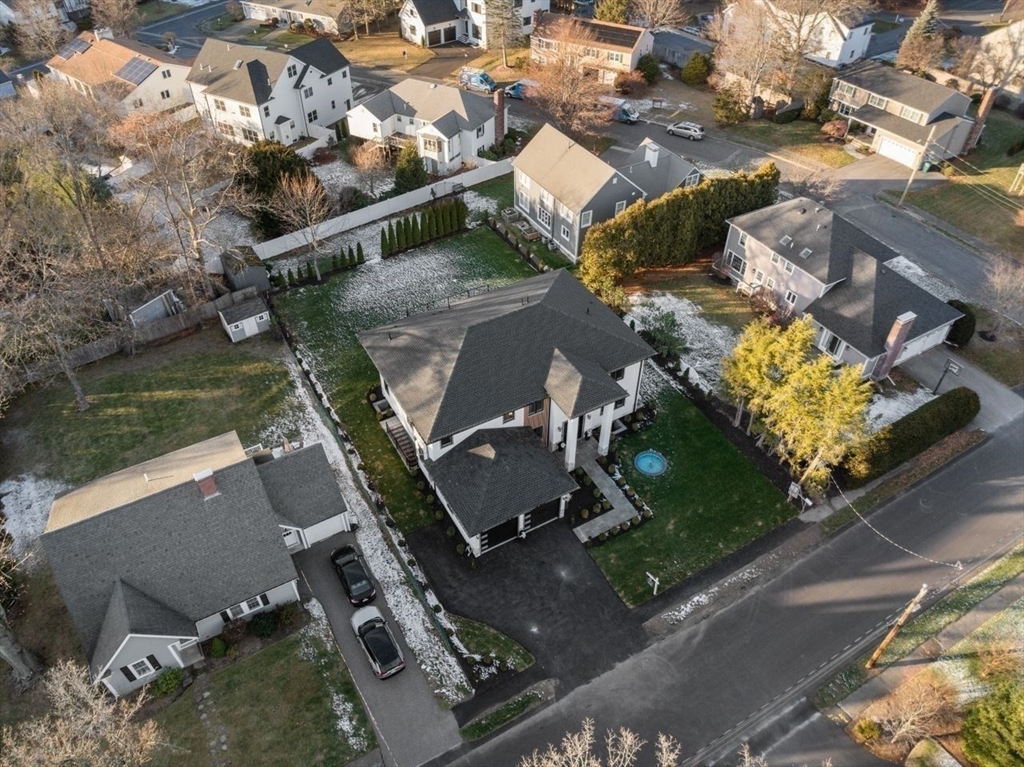 51 Pilgrim Road Needham, MA 02492 - Photo 42 of 42 an aerial view of a house with a yard and lake view