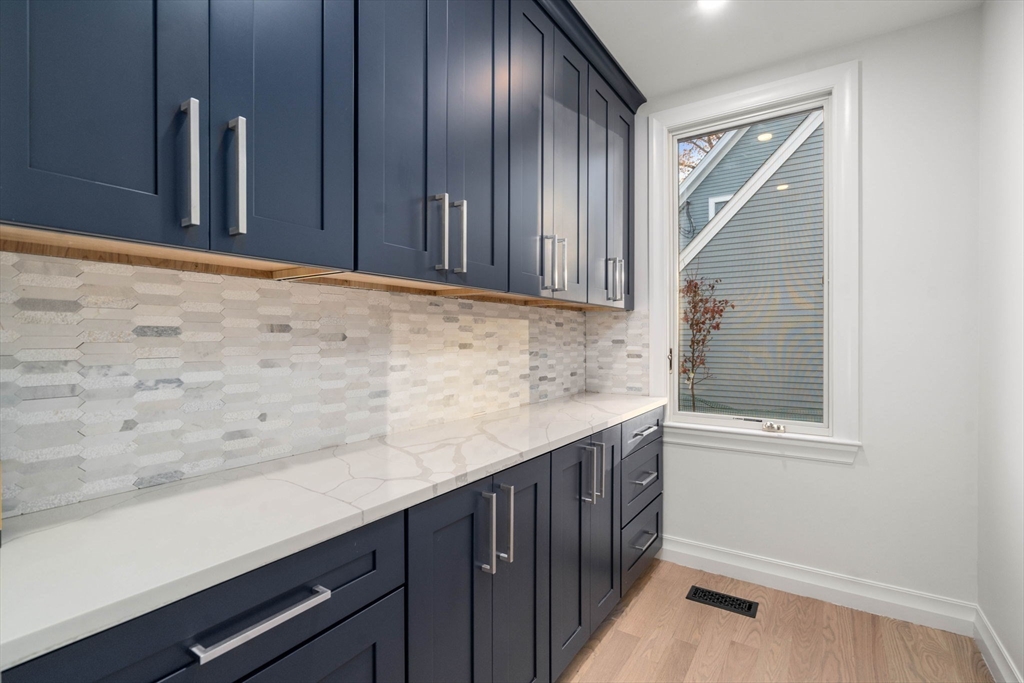 51 Pilgrim Road Needham, MA 02492 - Photo 9 of 42 a view of cabinets and wooden floor