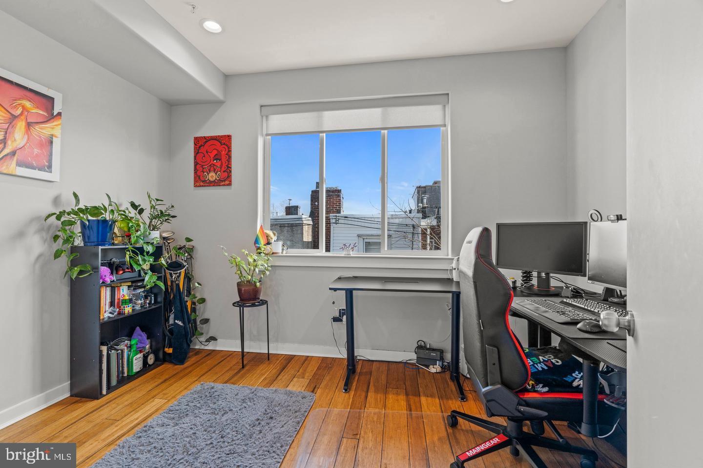 1751 South Taylor Street Philadelphia, PA 19145 - Photo 13 of 28 a work room with furniture a rug and potted plants