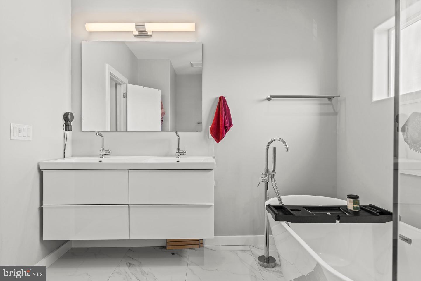 1751 South Taylor Street Philadelphia, PA 19145 - Photo 21 of 28 a bathroom with a sink and a mirror