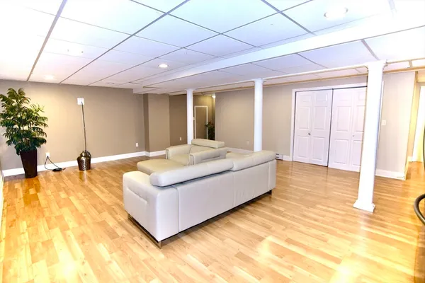 a spacious bedroom with a bed and a couch