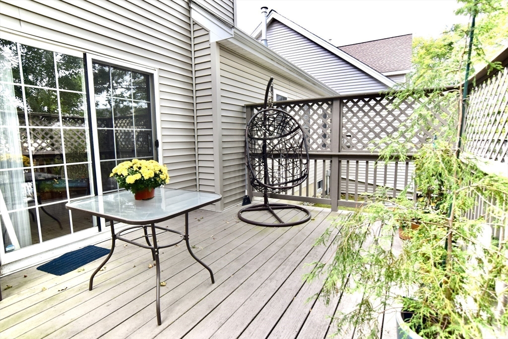 172 Edgehill Road, Unit 172 Norwood, MA 02062 - Photo 21 of 27 a view of a chairs and table on the wooden floor