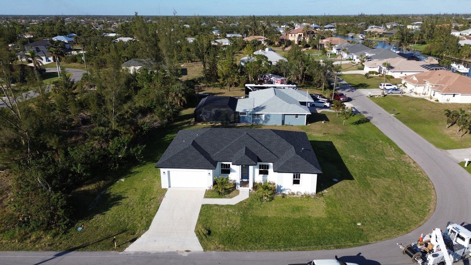 10625 Ayear Road Port Charlotte, FL 33981 - Photo 28 of 33 an aerial view of a house with garden space and street view