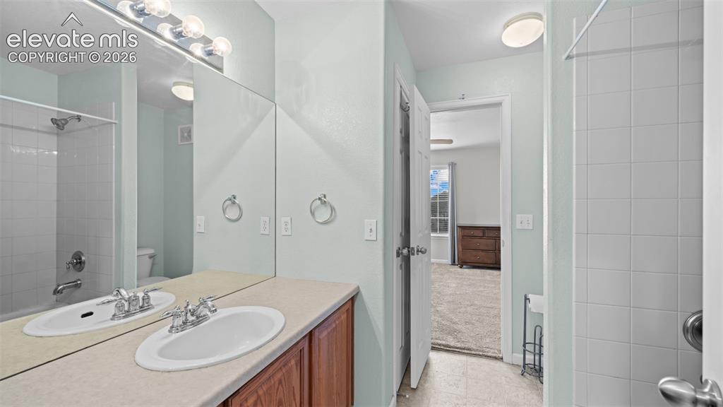 4023 Diamond Ridge View Colorado Springs, CO 80918 - Photo 19 of 31 a bathroom with a sink a toilet and shower
