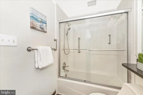 a bathroom with a shower and a shower
