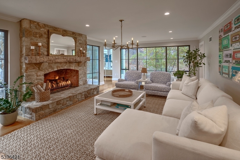 93 Pleasantville Road New Vernon, NJ 07976 - Photo 12 of 41 a living room with furniture fireplace and a large window