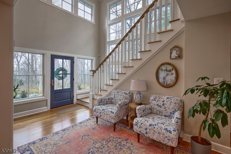 93 Pleasantville Road New Vernon, NJ 07976 - Photo 19 of 41 a living room with fireplace furniture and a large window