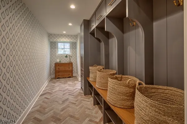 a bedroom with bed and a chandelier