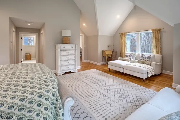 a bedroom with a bed and a couch
