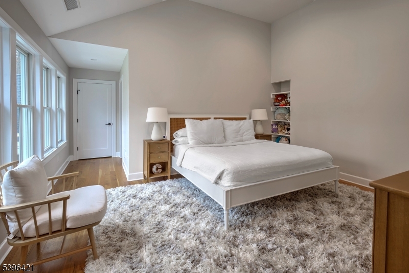 93 Pleasantville Road New Vernon, NJ 07976 - Photo 26 of 41 a bedroom with a bed and wooden floor