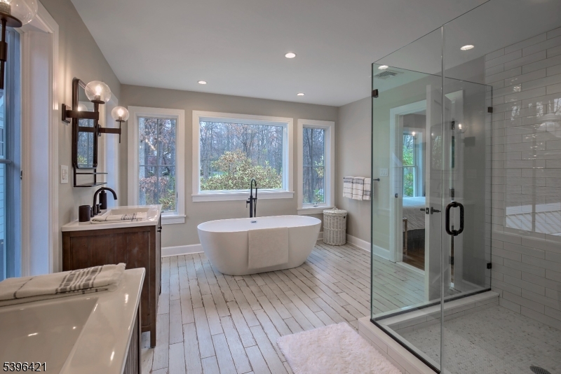 93 Pleasantville Road New Vernon, NJ 07976 - Photo 30 of 41 a large spacious bathroom with a tub shower and sink