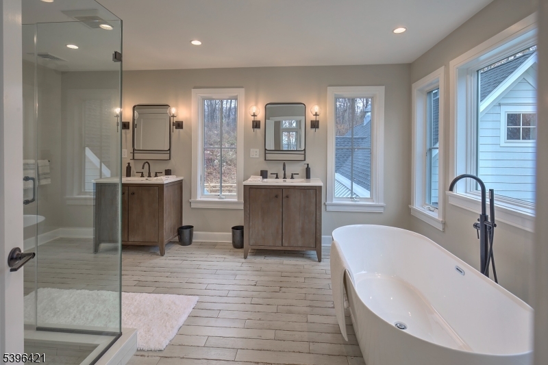 93 Pleasantville Road New Vernon, NJ 07976 - Photo 31 of 41 a bathroom with a bathtub and double vanity