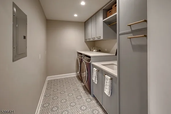 a kitchen with stainless steel appliances granite countertop a refrigerator and a stove