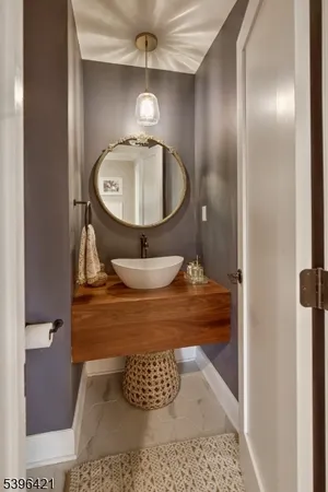 a bathroom with a sink and mirror
