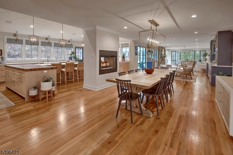 93 Pleasantville Road New Vernon, NJ 07976 - Photo 7 of 41 an open kitchen with dining table and wooden floors