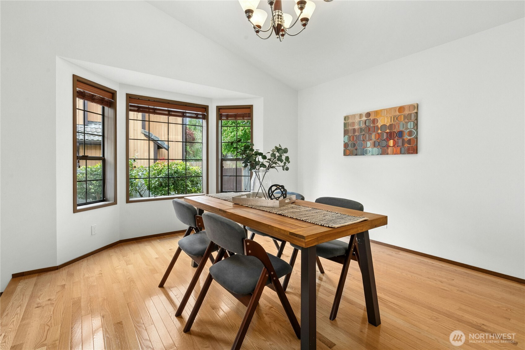 5211 103rd Street Southwest, Unit SW Mukilteo, WA 98275 - Photo 8 of 40 a view of a dining room with furniture window and wooden floor