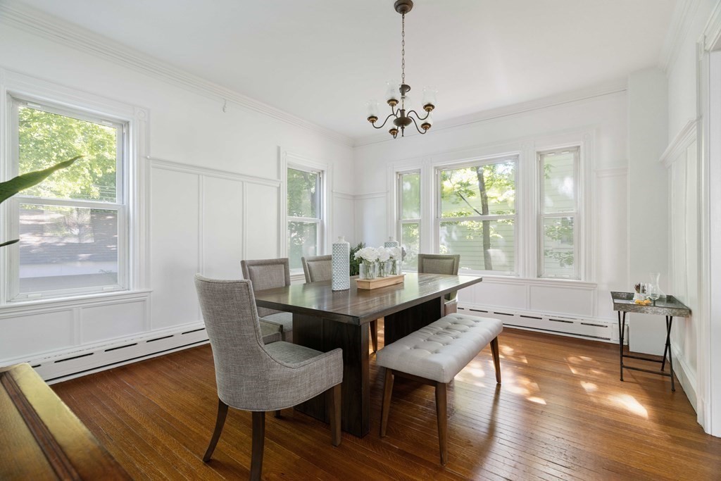 215 Clark Road Brookline, MA 02445 - Photo 14 of 41 a view of a dining room with furniture window and wooden floor