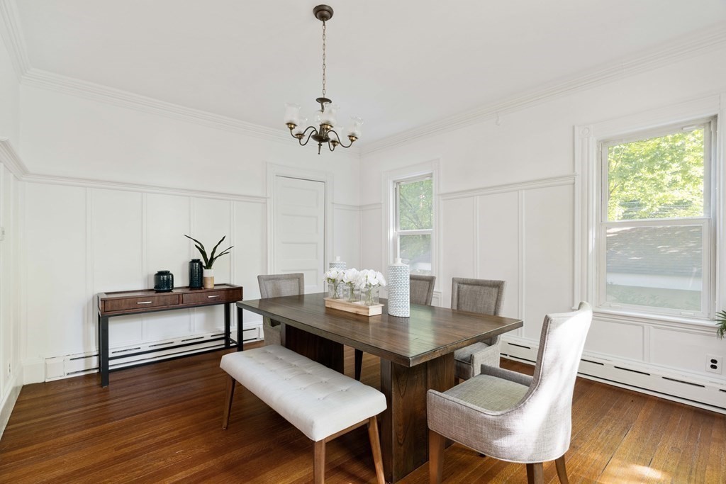 215 Clark Road Brookline, MA 02445 - Photo 15 of 41 a view of a dining room with furniture and wooden floor