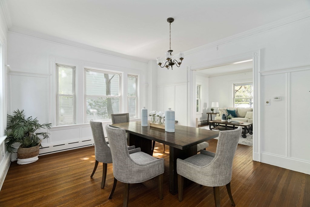 215 Clark Road Brookline, MA 02445 - Photo 17 of 41 a view of a dining room with furniture window and wooden floor