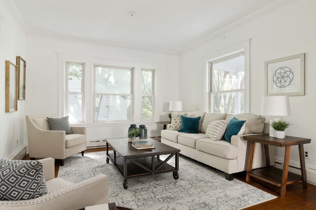215 Clark Road Brookline, MA 02445 - Photo 19 of 41 a living room with furniture and a large window