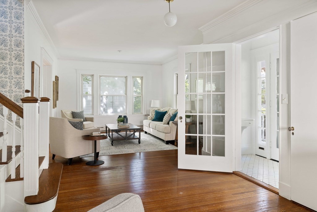 215 Clark Road Brookline, MA 02445 - Photo 2 of 41 a living room with furniture large window and wooden floor