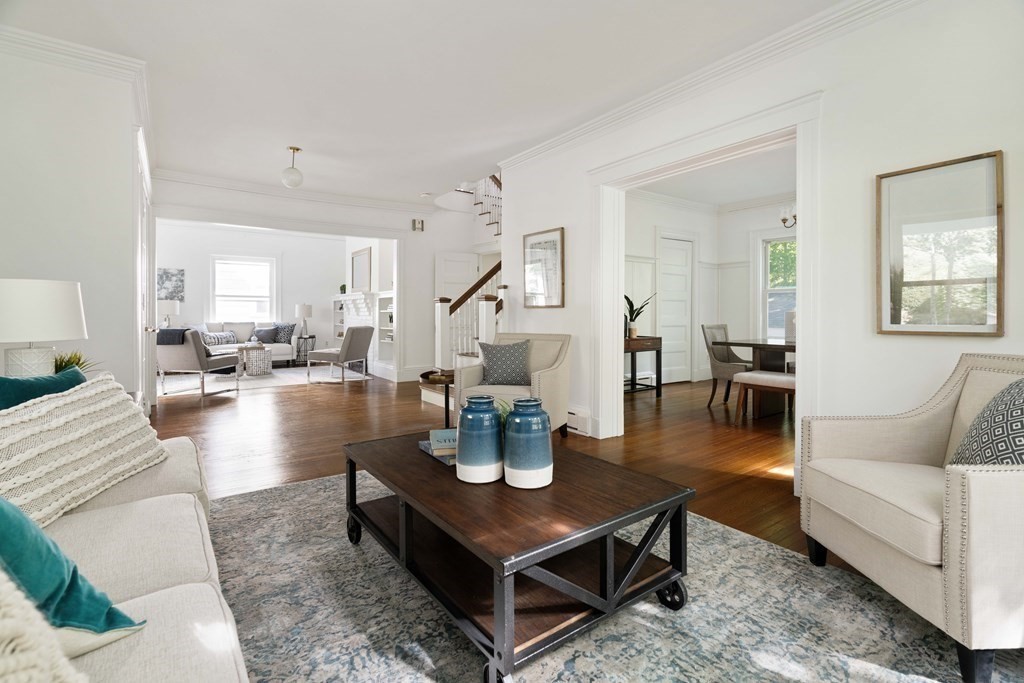 215 Clark Road Brookline, MA 02445 - Photo 21 of 41 a living room with couches and kitchen view with wooden floor