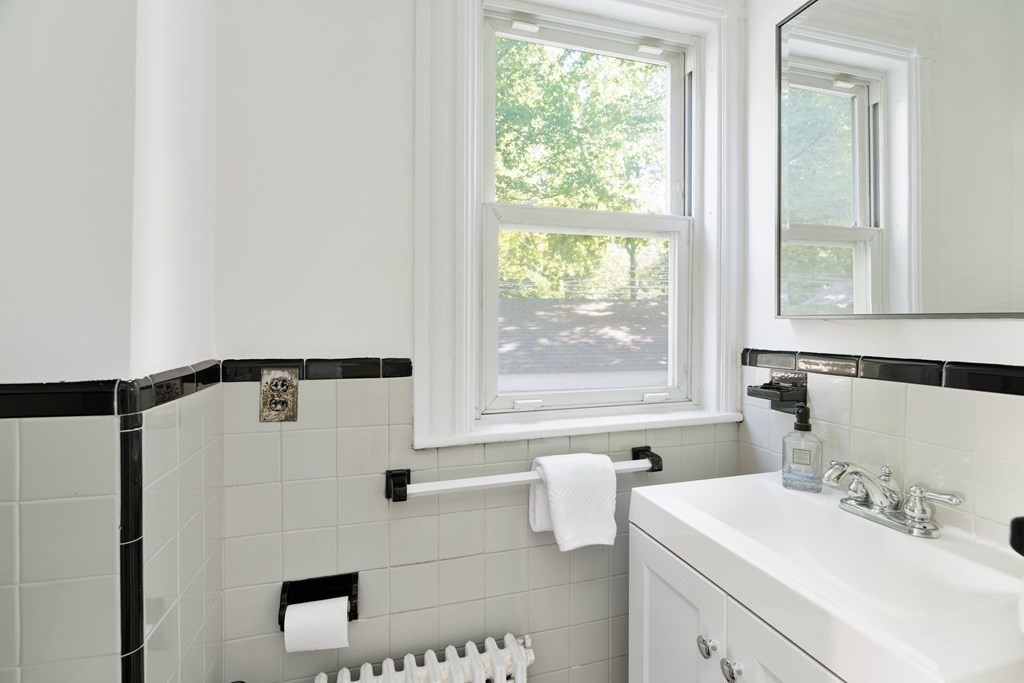 215 Clark Road Brookline, MA 02445 - Photo 24 of 41 a bathroom with a sink and a bathtub