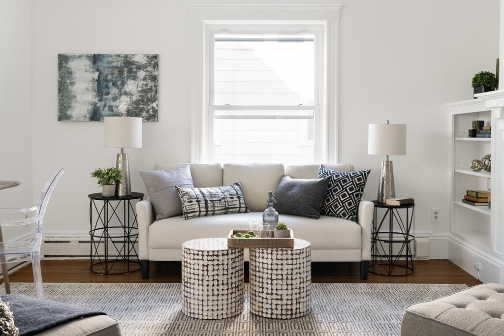 215 Clark Road Brookline, MA 02445 - Photo 4 of 41 a living room with furniture and a window
