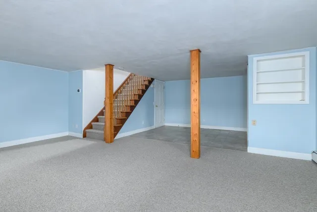 a view of an empty room with stairs