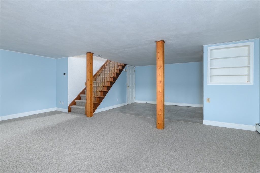 29 Manor Road Auburn, MA 01501 - Photo 13 of 21 a view of an empty room with stairs