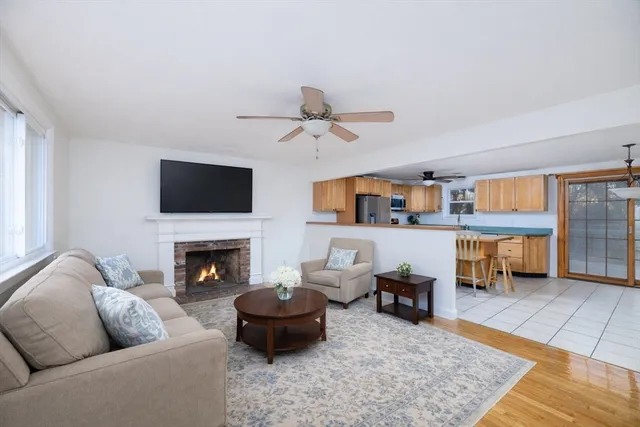 a living room with furniture and a fireplace