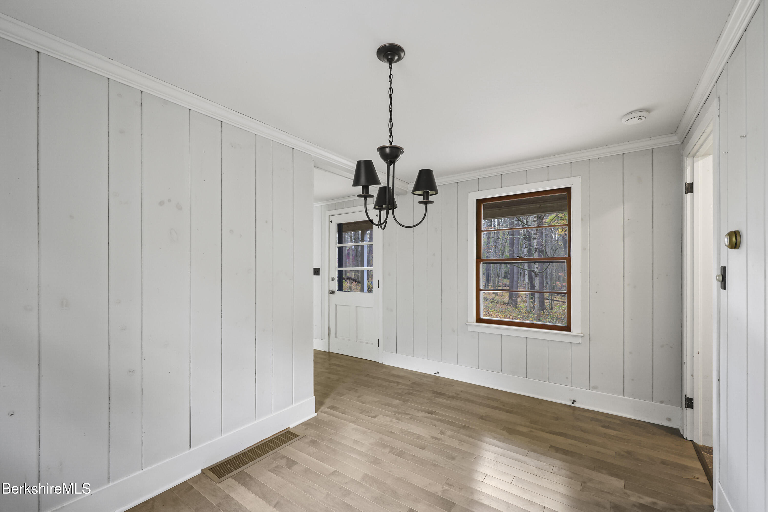 245 Long Pond Road Great Barrington, MA 01230 - Photo 11 of 34 a view of an empty room with window and wooden floor