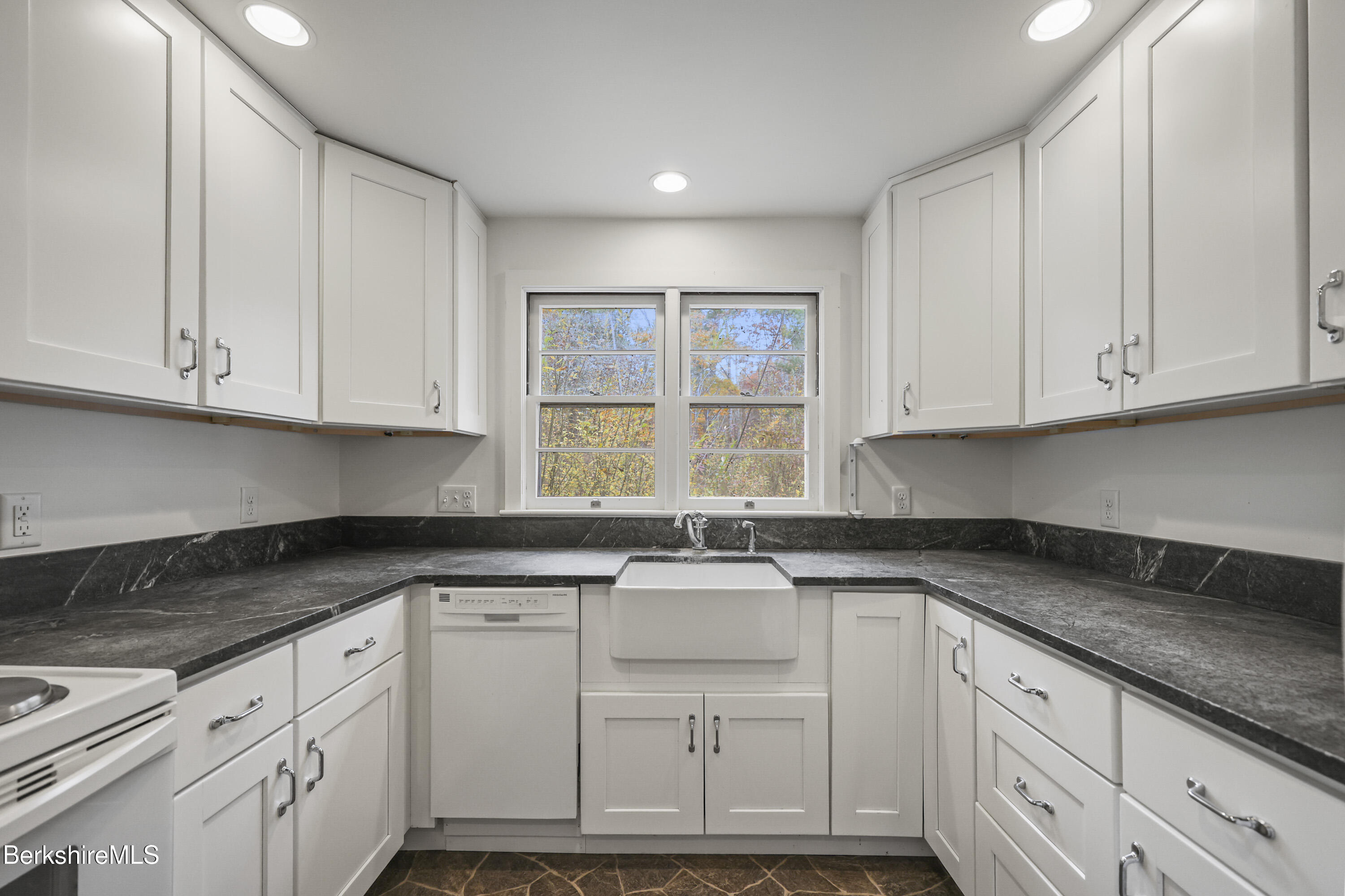 245 Long Pond Road Great Barrington, MA 01230 - Photo 12 of 34 a kitchen with granite countertop white cabinets and a sink
