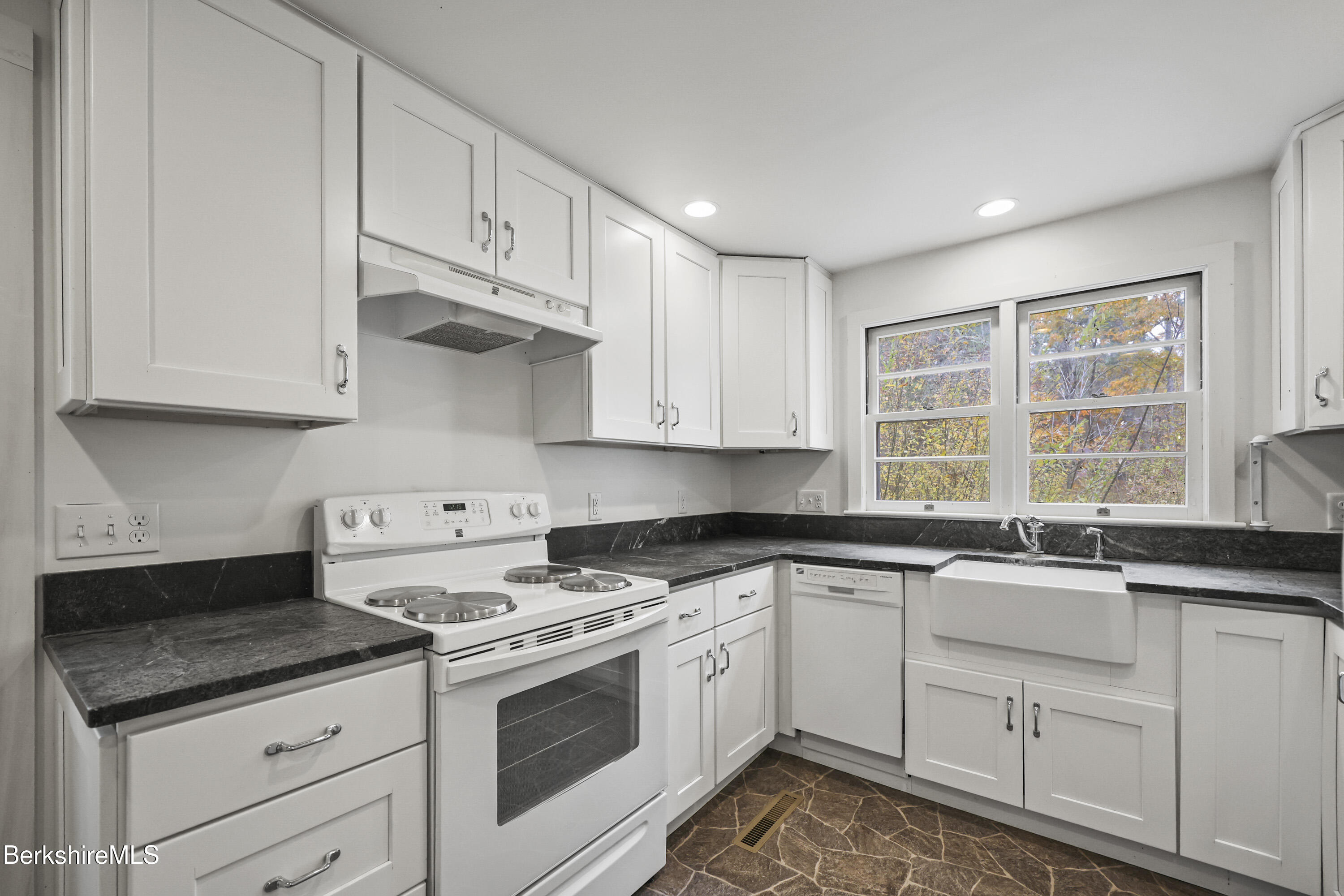 245 Long Pond Road Great Barrington, MA 01230 - Photo 13 of 34 a kitchen with stainless steel appliances granite countertop a sink stove and cabinets