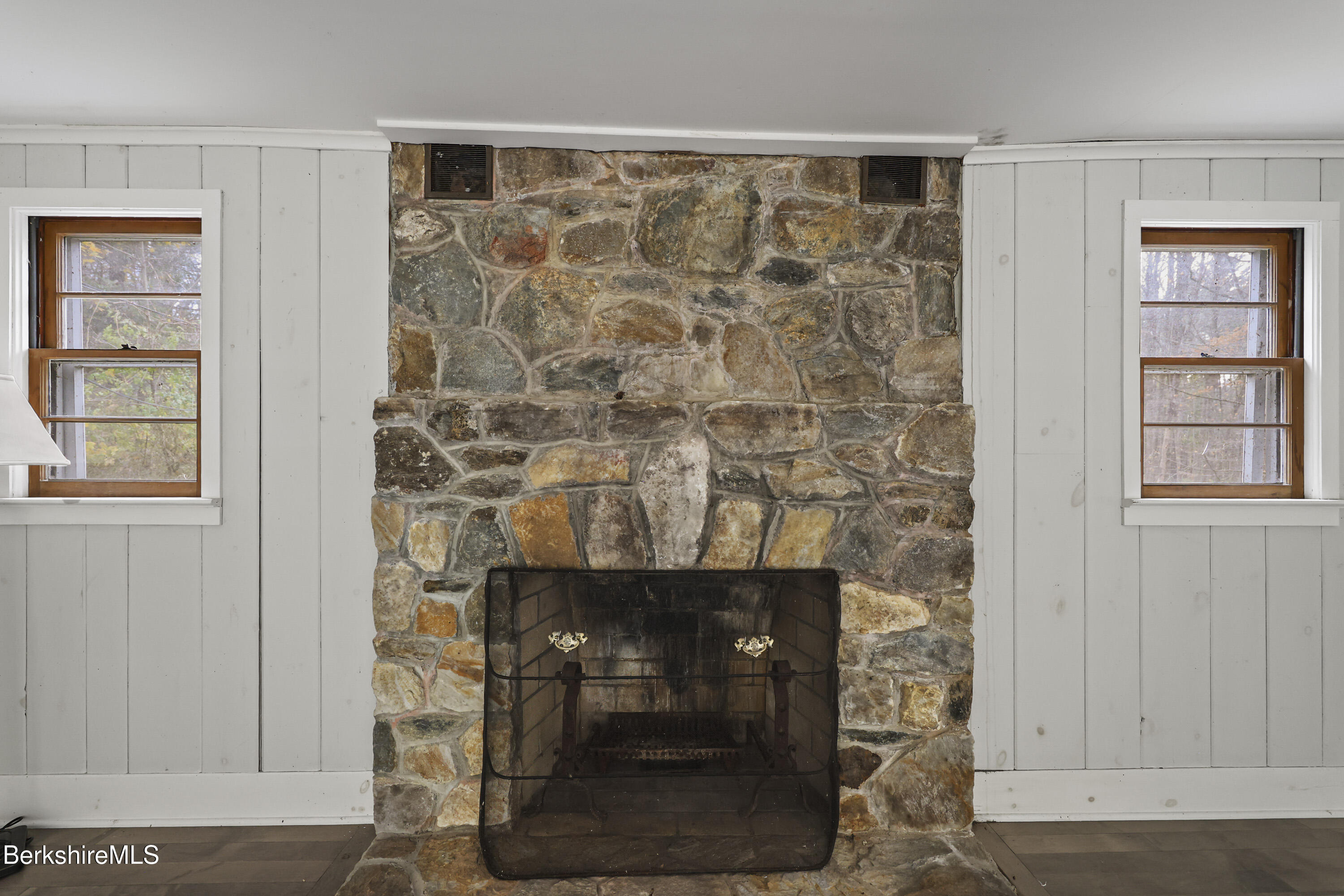245 Long Pond Road Great Barrington, MA 01230 - Photo 8 of 34 a living room with a fireplace