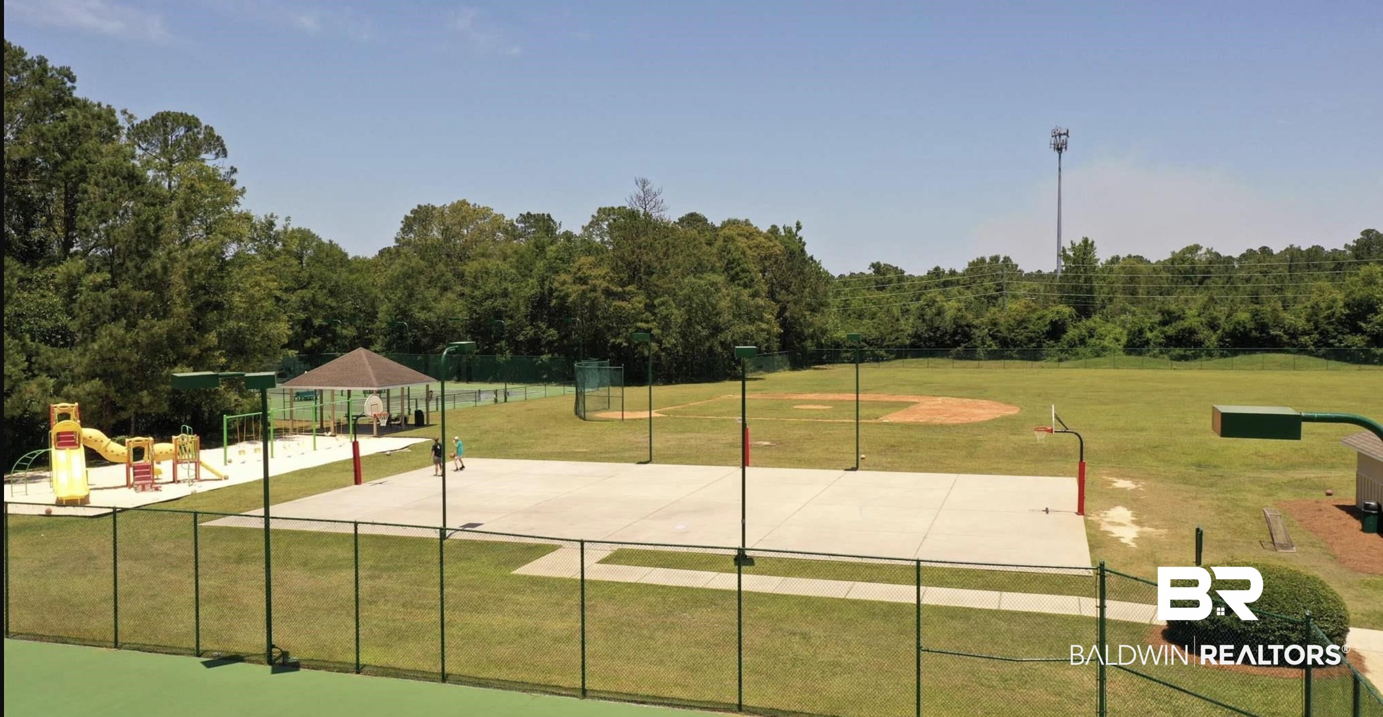 8137 Pine Run Daphne, AL 36527 - Photo 58 of 67 Recreational area featuring a concrete basketball court, a baseball diamond, and a playground with slides and swings