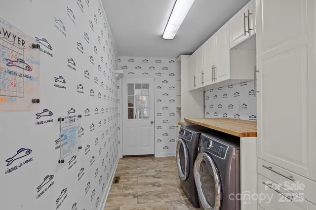 a view of a hallway with washer and dryer
