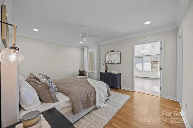 a bedroom with a large bed and a window