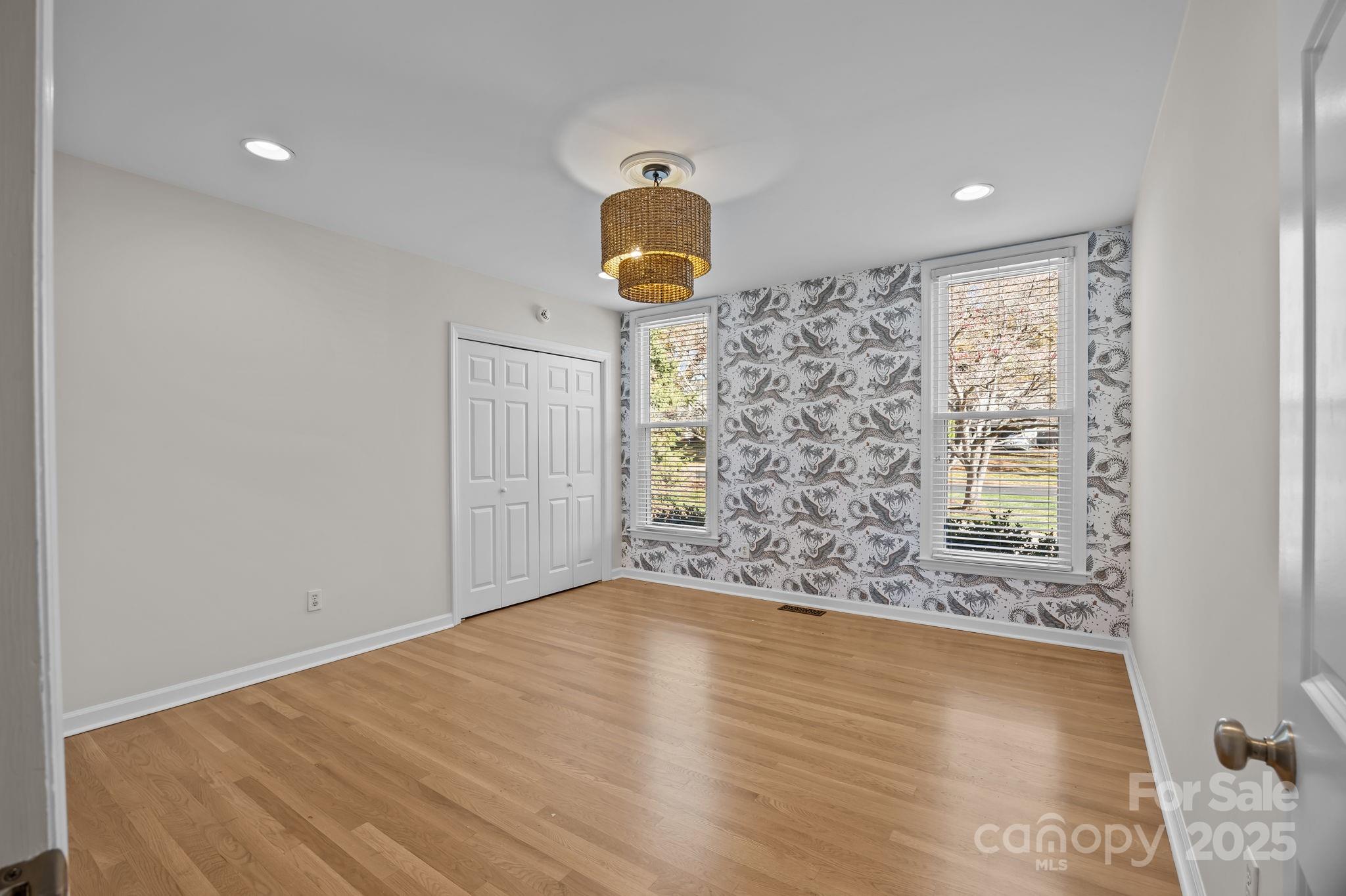 1022 Churchill Road Davidson, NC 28036 - Photo 22 of 39 wooden floor in an empty room with a window