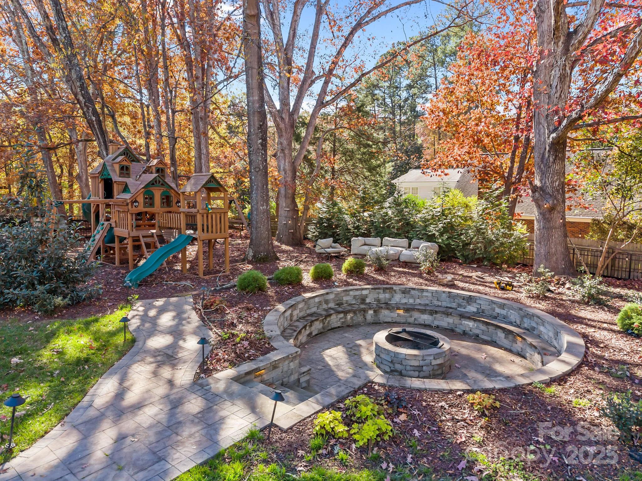1022 Churchill Road Davidson, NC 28036 - Photo 35 of 39 a backyard of a house with lots of green space