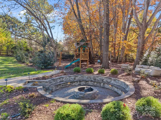 a view of a backyard with plants and trees
