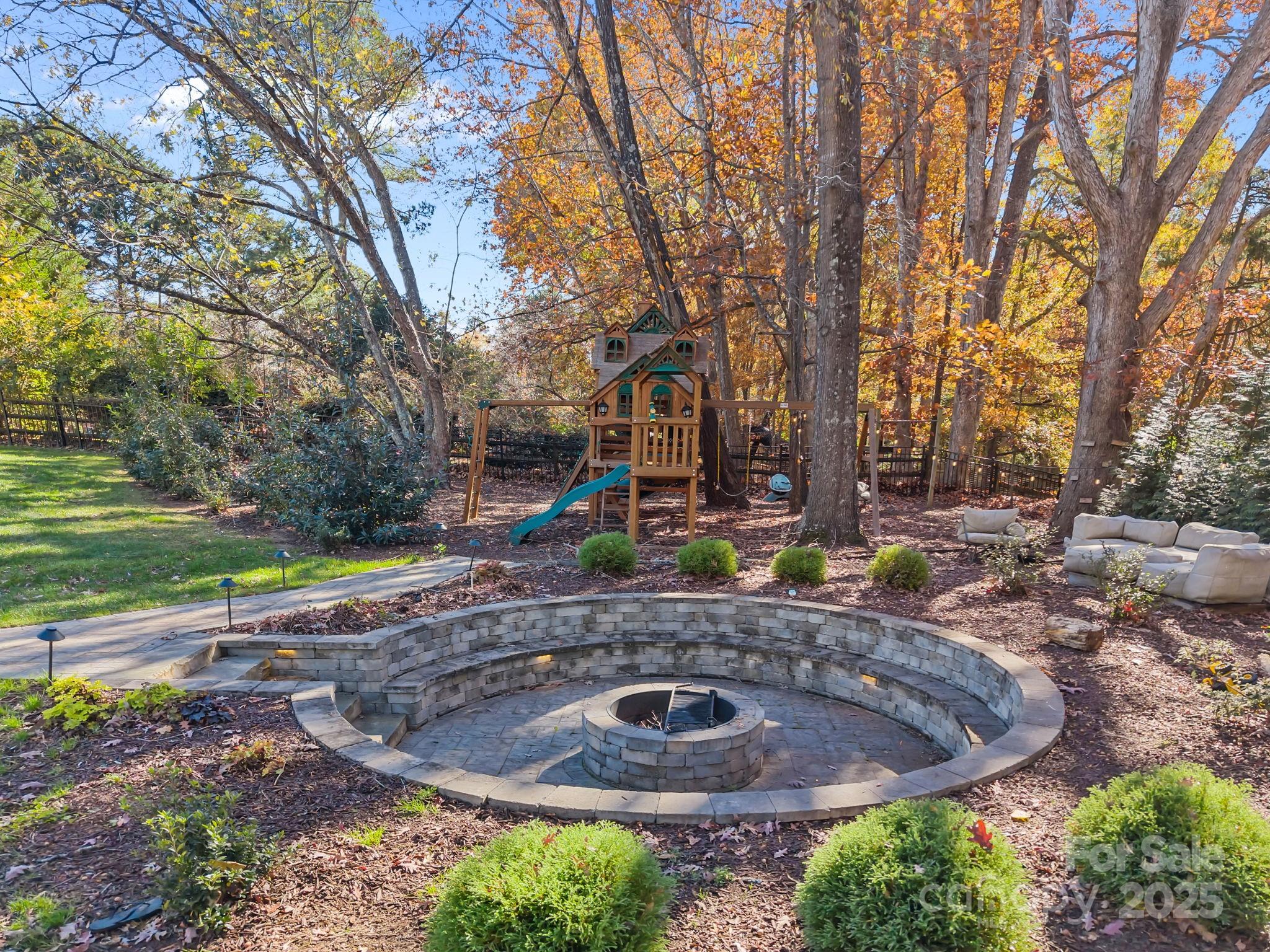 1022 Churchill Road Davidson, NC 28036 - Photo 36 of 39 a view of a backyard with plants and trees