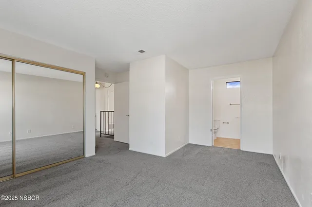 a bathroom with a toilet and bathtub