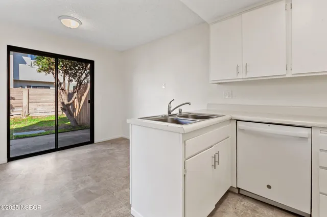 a bathroom with a sink and shower