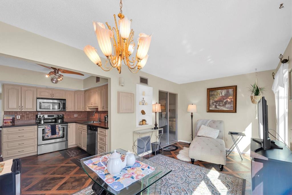 2469 Franciscan Drive, Unit 53 Clearwater, FL 33763 - Photo 16 of 51 a living room with stainless steel appliances kitchen island granite countertop furniture and a view of kitchen