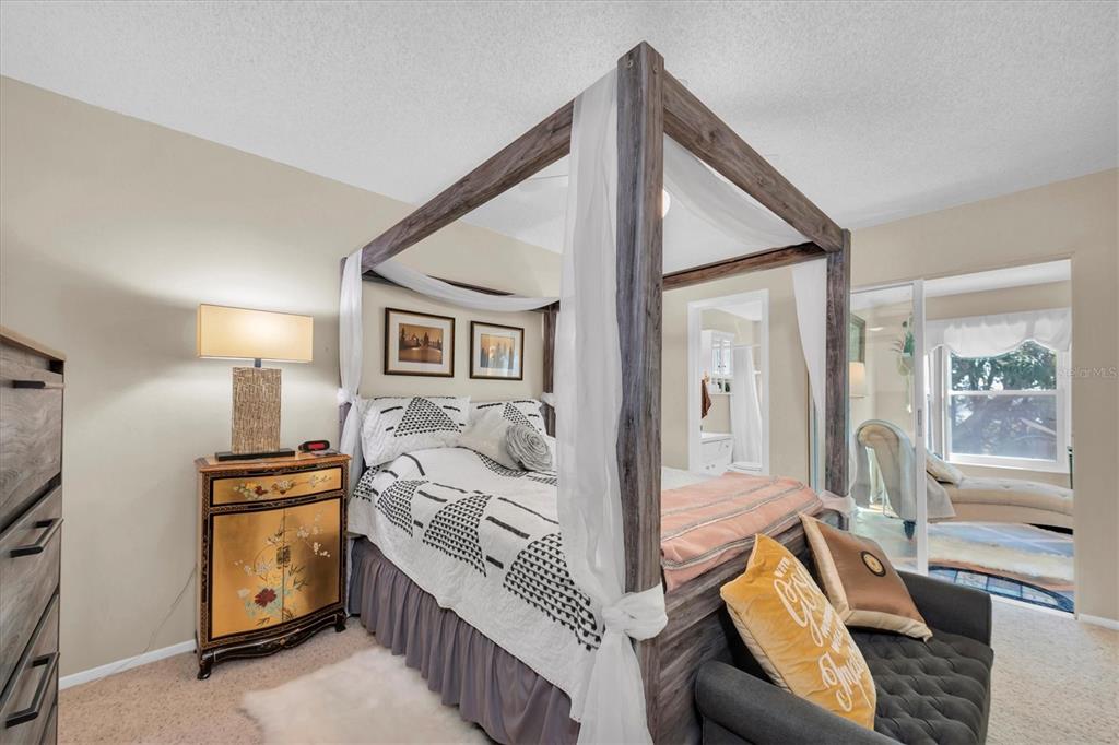 2469 Franciscan Drive, Unit 53 Clearwater, FL 33763 - Photo 17 of 51 a bedroom with furniture and a flat screen tv