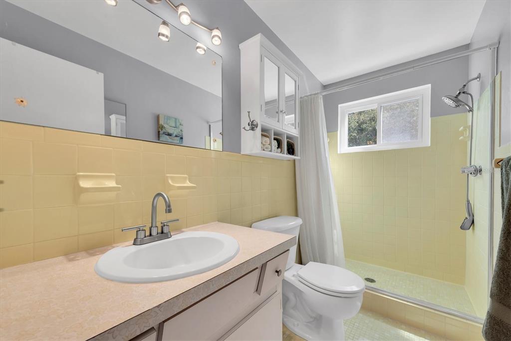 2469 Franciscan Drive, Unit 53 Clearwater, FL 33763 - Photo 20 of 51 a bathroom with a sink toilet and shower