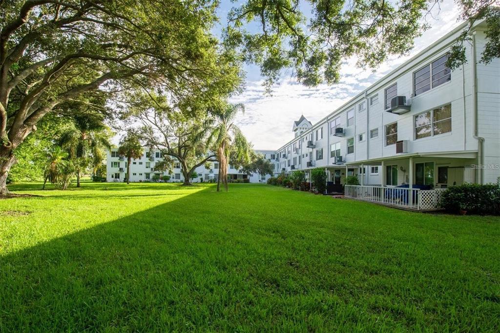 2469 Franciscan Drive, Unit 53 Clearwater, FL 33763 - Photo 25 of 51 a view of building with garden