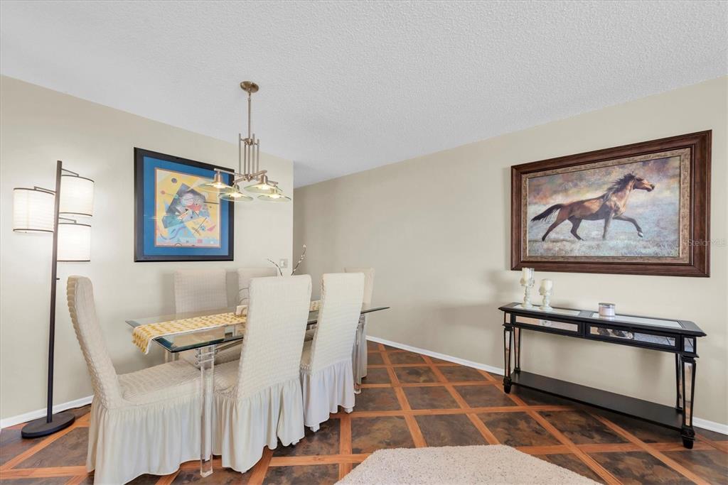 2469 Franciscan Drive, Unit 53 Clearwater, FL 33763 - Photo 9 of 51 a dining room with furniture and window